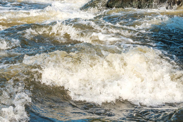 istock waves on a mountain river with foam and spray rapids 1208554697