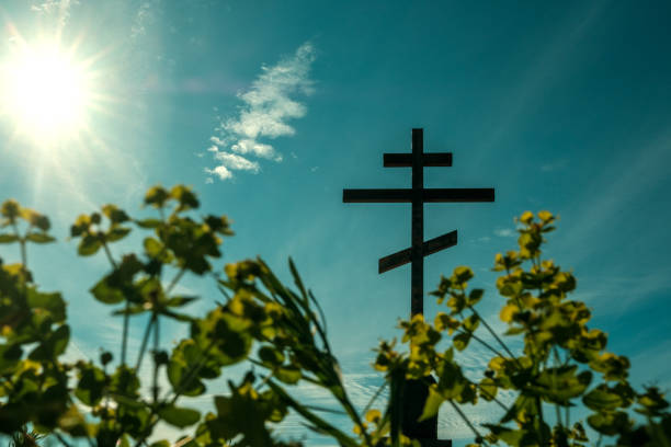 istock view from below through the grass on the Orthodox cross against the blue sky 1208554936
