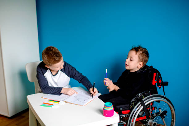 istock A boy and a boy in wheelchair learn at home 1208554972