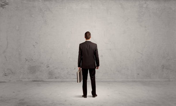 istock Businessman lost in empty urban space 1208556529