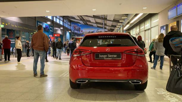 Rear view of new beautiful sport Mercedes-Benz Junge Sterne inside Baden Airport Baden-Baden, Germany - Nov 12, 2019: Rear view of new beautiful sport Mercedes-Benz Junge Sterne inside Baden Airport with people waiting of their relatives to arrive sterne stock pictures, royalty-free photos & images