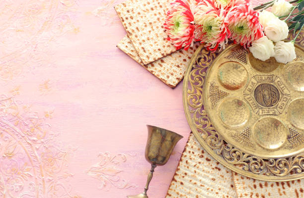 istock Pesah celebration concept (jewish Passover holiday). Traditional pesah plate text in hebrew: Passover, horseradish, celery, egg, bone, maror, charoset 1208558593