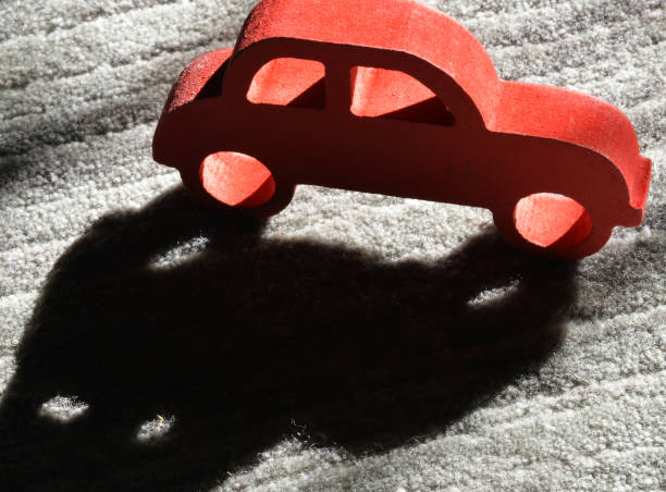 istock red toy car on grey background 1208559388