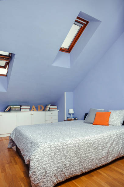 istock Bedroom in an attic with double bed 1208561064