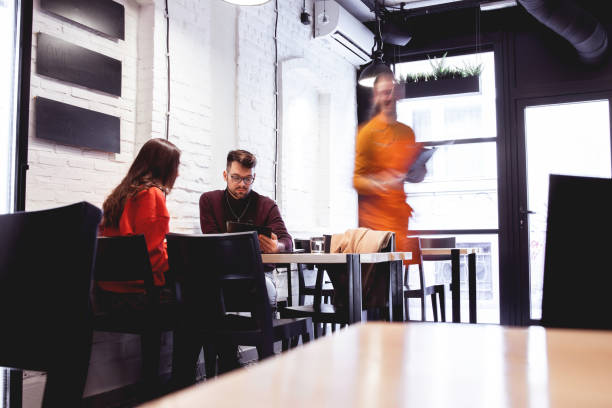 istock Waiter Takes Order From a young Couple 1208561214