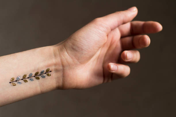 istock young woman's hand with temporary tattoo 1208561235