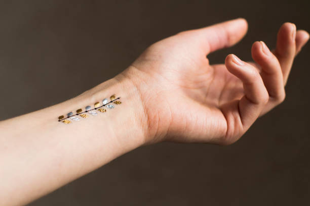 istock young woman's hand with temporary tattoo 1208561265