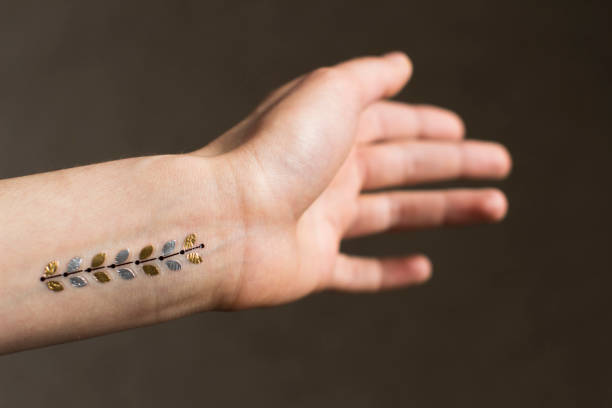 istock young woman's hand with temporary tattoo 1208561297