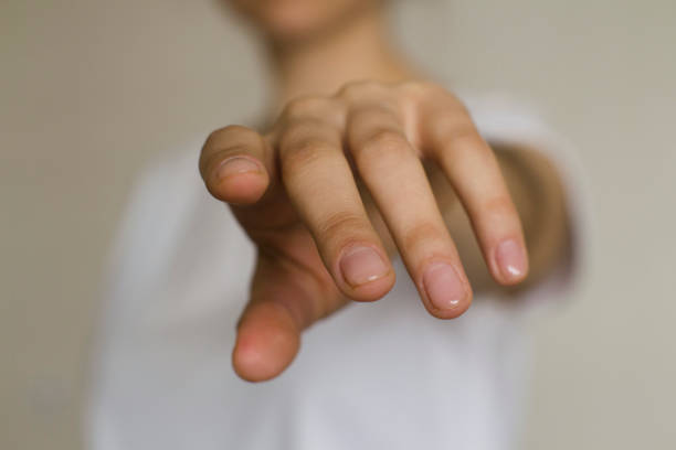 istock young woman's hand reaching out 1208561370