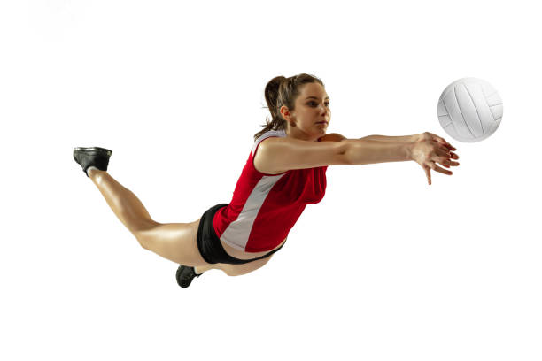 Young female volleyball player isolated on white studio background in flight and motion