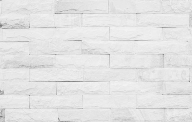 istock Medieval natural stone wall texture background or boundary the rock seamless abstract and decor fragment of design vintage wallpaper pattern chipped ancient from white color for interior copy space. 1208562277
