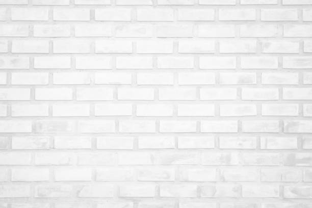 istock White brick wall texture background in room. Brickwork stonework interior, rock old clean concrete grid uneven abstract weathered bricks tile design, horizontal architecture wallpaper. 1208562789