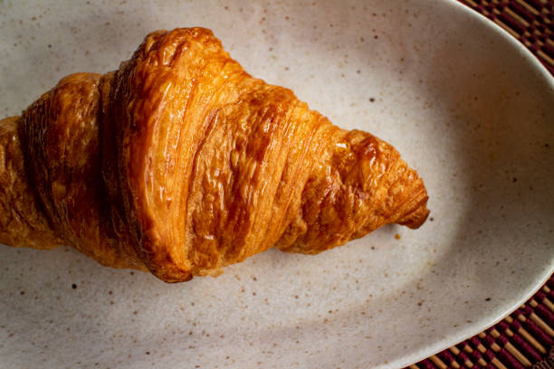 istock Delicious croissant on a ceramic plate 5 1208563946