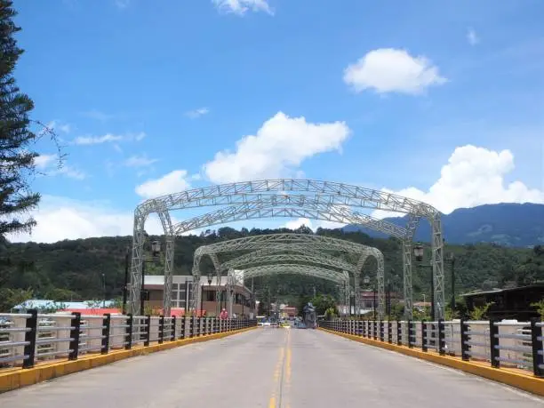 Steel arch suspension road and pedestrian bridge over the Caldera River in Boquete, Panama Highlands.