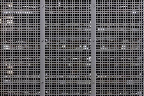 istock Metal grill background with blurred background of technological equipment, copy space 1208567610