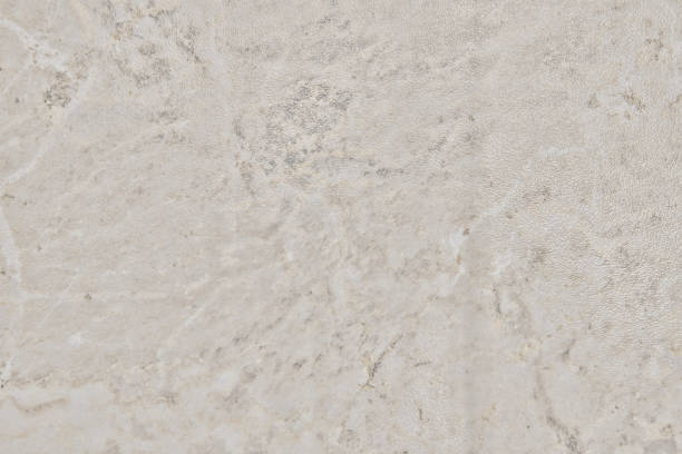 istock Texture of shiny beige stone, close-up background 1208567937