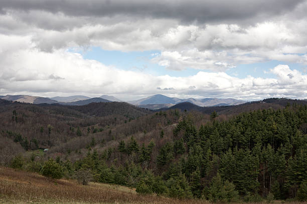 Spring clouds and sunshine on a Blue Ridge Mountains landscape stock photo