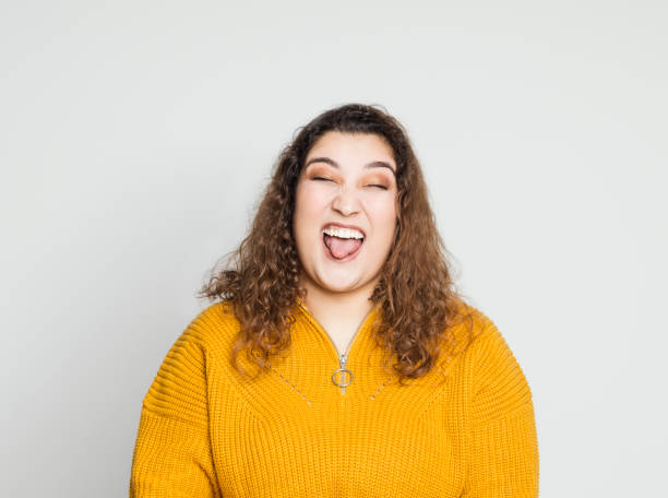 Teenage girl making an ugly face Teenage girl making an ugly face fat ugly face stock pictures, royalty-free photos & images