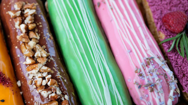 istock Close-up multi-colored eclairs with different taste. View from above. Modern  Breakfast concept 1208575561