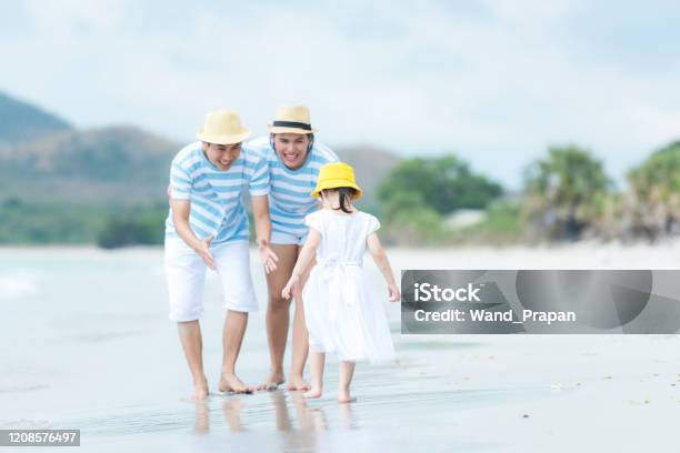 Happy Family Summer Sea  Beach Vacation Asia Young people Lifestyle Travel Enjoy Fun And Relax In Holiday Travel And Family Concept Stock Photo - Download Image Now
