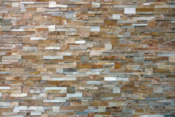 istock tightly cut stacked slate rock wall distance view 1208576857
