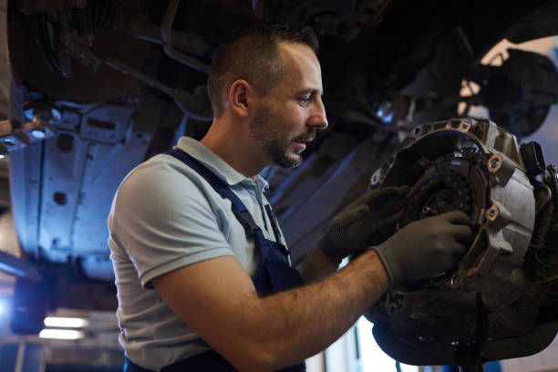 istock Mechanic Repairing Car 1208577159