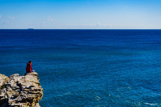 istock Tourist woman on sea cliffs in Spain 1208578071