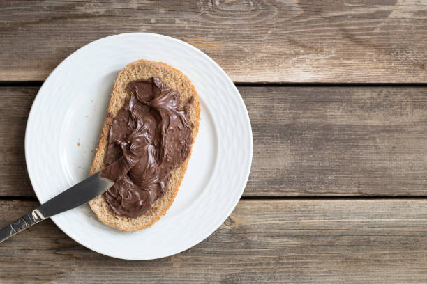 istock Slice of bread with chocolate cream. Top view. 1208578862