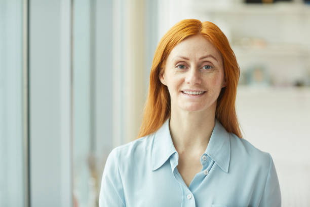 istock Smiling Red Haired Woman 1208579689