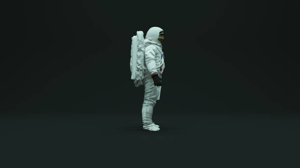 istock Astronaut with Gold Visor and White Spacesuit With Dark Grey Background with Neutral Diffused Top Kino Lighting 1208580035