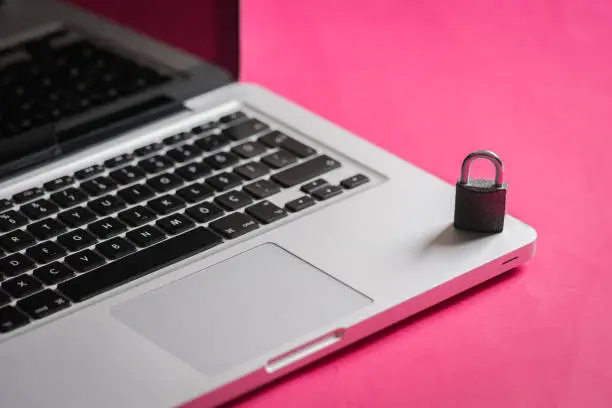 Photo of Padlock on laptop keyboard