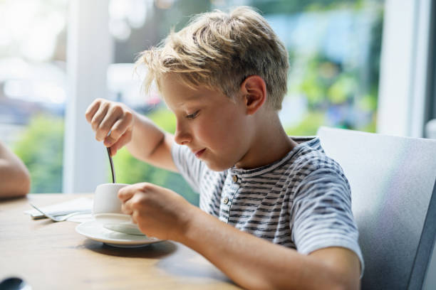 istock Little boy enjoying eating soup 1208583107