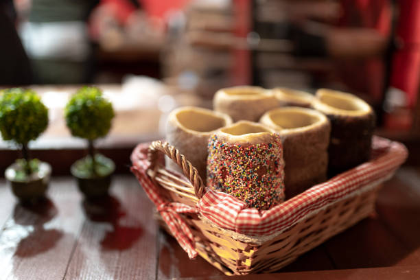 Young Caucasian beautiful girls enjoying eating chimney cake