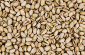 Texture of roasted pistachios as a background