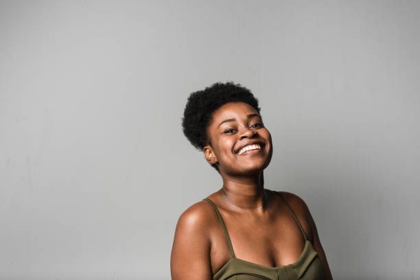istock Positive young woman in studio 1208585283