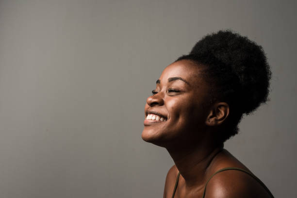 istock Laughing woman with eyes closed 1208585309