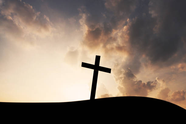 The cross on mountain sunset background The cross on mountain sunset background hope god lighting technique tree stock pictures, royalty-free photos & images