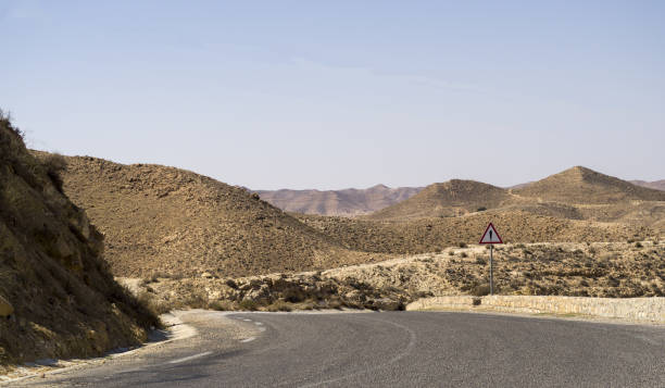 istock Route to Sahara desert full of rocks 1208588087