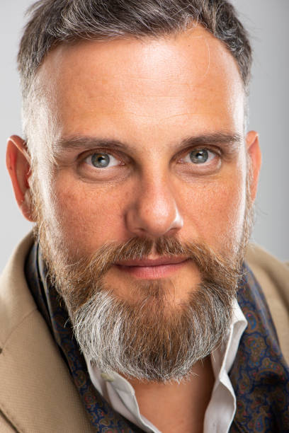istock Close-up of bearded caucasian man looking at camera 1208588220