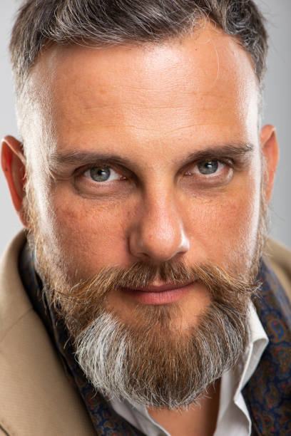 istock Close-up of bearded caucasian man looking at camera 1208588275