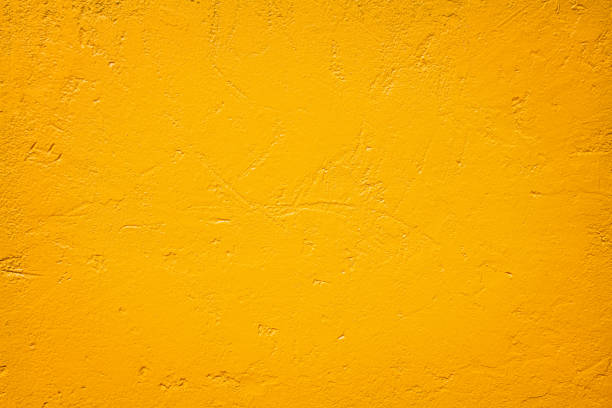 istock Gold paint patterns or dark orange texture concrete wall  for background 1208589271