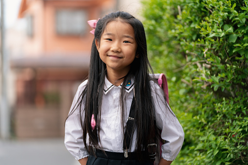 Portrait of a young school girl. Tokyo, Japan