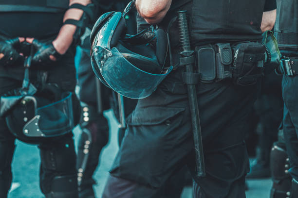 police officers in full combat uniform police officers in full combat uniform, protection riot shield stock pictures, royalty-free photos & images