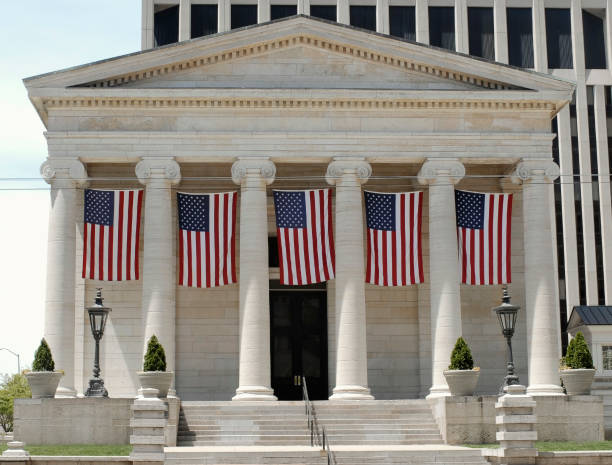 istock Historic Old Court House with Hanging Flags 1208595041