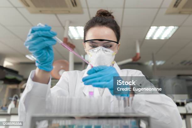 Female Scientist Working In The Cdc Laboratory Stock Photo - Download Image Now - Laboratory, Coronavirus, Scientist
