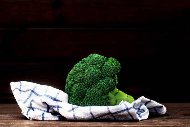 istock Fresh green broccoli  in bowl on wooden table close up. Copyspace 1208596364