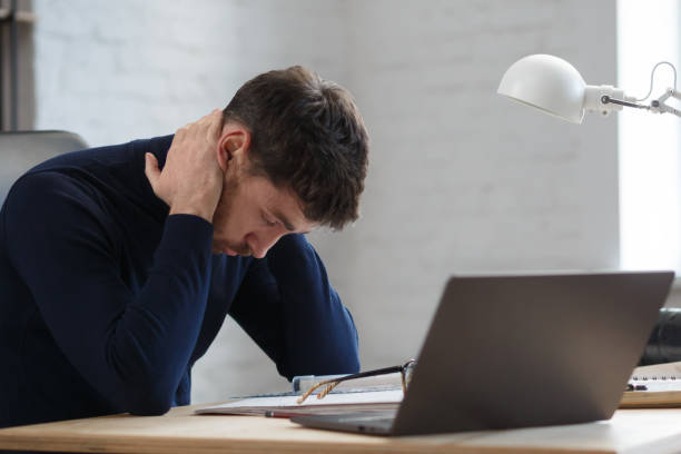 istock Tired architect working overtime in office. Stressed businessman have financial problems and searching ideas to overcome financial crisis. Entrepreneur in bankruptcy. Burnout and overwork concept 1208596734