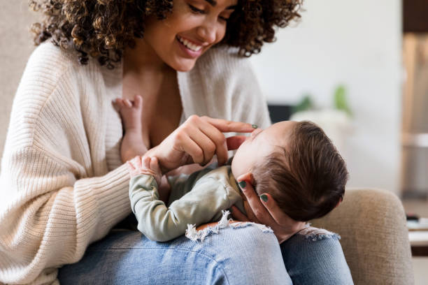 istock Mom plays with adorable baby boy 1208596757