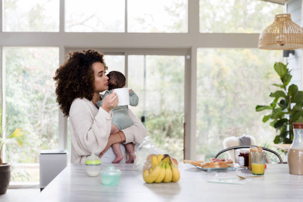 istock Tired mom drinks coffee in the morning 1208596788