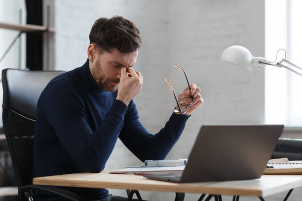 istock Tired architect working overtime in office. Stressed businessman have financial problems and searching ideas to overcome financial crisis. Entrepreneur in bankruptcy. Burnout and overwork concept 1208596821